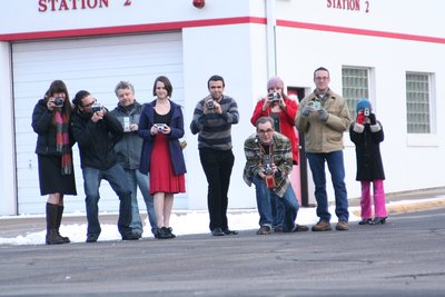 Shakopee artists have their eye on the downtown fire station at the corner of Second Avenue and Scott Street. Firefighters moved out Saturday. Pictured from left: Marla Estenson, Adam Jurewicz, Franklin Haws, Jocelyn Jourdan (of Chaska), Jason Huntzinger, Mike Haeg, Tammy Dahlke, Todd Jacobs and Autumn Haeg, 7. 
